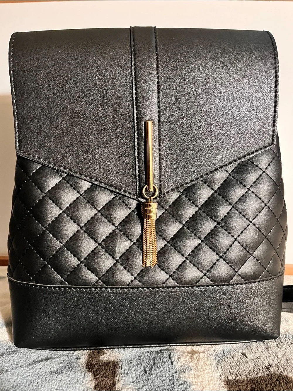 Black Quilted Backpack with Gold Charm